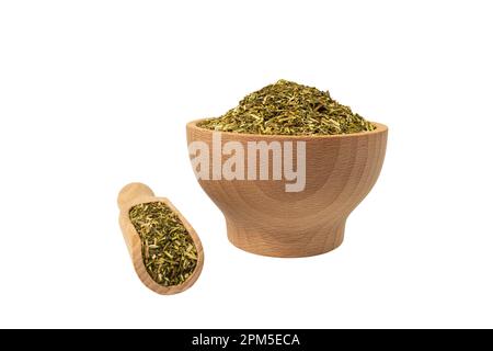passion flower herb in latin - passiflora incarnata in wooden bowl and scoop isolated on white background. Passiflora incarnata, commonly known as may Stock Photo