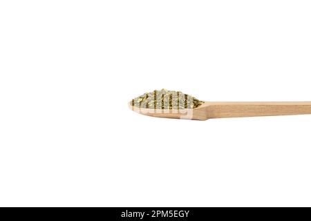 passion flower herb in latin - passiflora incarnata on wooden spoon isolated on white background. Passiflora incarnata, commonly known as maypop, purp Stock Photo