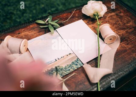 Italian wedding invitation on a wooden chest Stock Photo