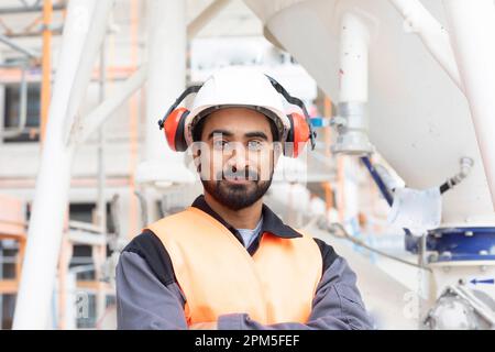 young technician safety glasses and helmet working Stock Photo