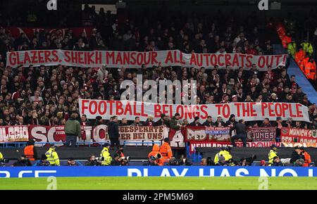 Bayern Munich fans hold up a sign saying 'Glazers, Sheikh Mansour, All Autocrats Out. Football Belongs To The People' during the UEFA Champions League quarter final first leg match at Etihad Stadium, Manchester. Picture date: Tuesday April 11, 2023. Stock Photo