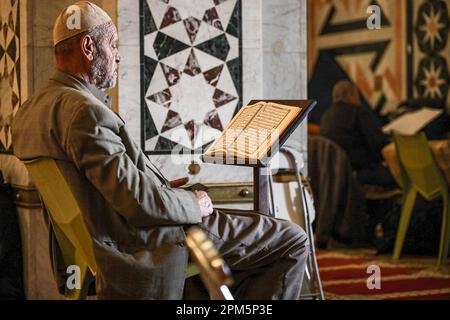 Jerusalem, Israel. 11th Apr, 2023. A Muslim reads the Qur'an in Al-Aqsa Mosque, during the last ten days of the holy month of Ramadan, in which Muslims celebrate Laylat al-Qadr, the night of which cannot be determined with certainty. Muslims prepare to receive Laylat al-Qadr in the last 10 days of Ramadan. Laylat al-Qadr is a special night that is repeated every Hijri year in the blessed month of Ramadan. It is one of the last ten nights of Ramadan. It was mentioned in the Holy Qur'an and the biography of the Prophet Muhammad, so it is of great importance and privacy. (Credit Image: © Saeed Stock Photo