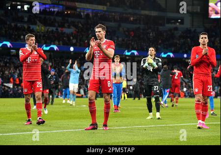 Bayern Munich's Thomas Muller (left), Leon Goretzka and Cavaco Joao Cancelo applaud the fans after the final whistle in the UEFA Champions League quarter final first leg match at Etihad Stadium, Manchester. Picture date: Tuesday April 11, 2023. Stock Photo