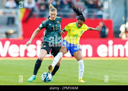 Nuremberg, Deutschland. 11th Apr, 2023. firo : 04/11/2023, football, soccer, friendly match DFB women country game national team Germany - Brazil Alexandra Popp (Germany) in duels with Kerolin (Brazil) Credit: dpa/Alamy Live News Stock Photo