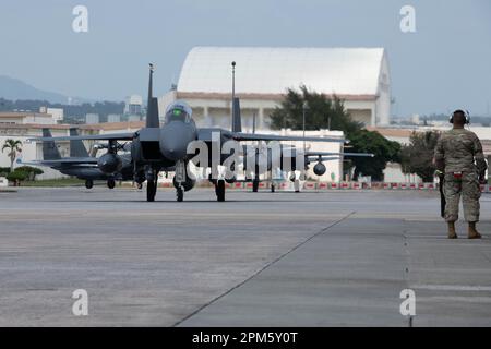 U.S. Air Force F-15E Strike Eagles assigned to the 336th Fighter Squadron taxi after arriving at Kadena Air Base, Japan, April 8, 2023. The Strike Eagle is a dual-role fighter with air-to-air and air-to-ground missions. An array of avionics and electronics systems gives the F-15E the capability to fight at low altitude, day or night and in all weather. (U.S. Air Force photo by Airman 1st Class Tylir Meyer) Stock Photo