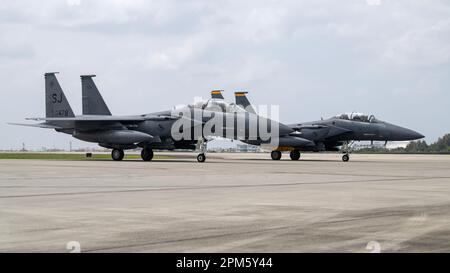 F-15E Strike Eagles assigned to the 336th Fighter Squadron arrive at Kadena Air Base, Japan, April 8, 2023. The Strike Eagles arrived from Seymour Johnson Air Force Base, North Carolina, to ensure continuous fighter presence through the phased return of Kadena’s fleet of F-15C/D Eagles to the United States. (U.S. Air Force photo by Senior Airman Jessi Roth) Stock Photo