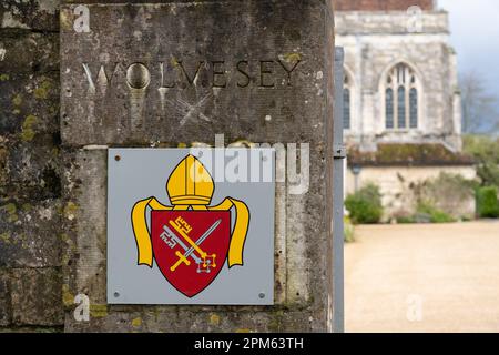 The entrance to Wolvesey Palace, the official residence and office of the Bishop of Winchester, showing the arms of the Bishop. Winchester, UK Stock Photo