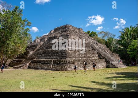 Costa Maya, Mexico - March 29, 2023: Tourists at the ancient mayan ruins of Chacchoben in the jungle near the cruise terminal at Costa Maya. Stock Photo