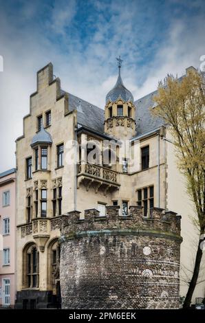 the oldest preserved roman tower in cologne from the year 50 in front of a neo-gothic building from 1898 Stock Photo