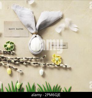 Easter Bunny Ears, eggs and spring willow branches top view flat lay. Minimal styled Easter card concept Stock Photo