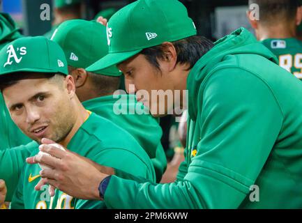 Oakland Athletics shortstop Aledmys Diaz barehands a ball hit by Cleveland  Guardians' Andres Gimenez during the second inning of a baseball game,  Thursday, June 22, 2023, in Cleveland. (AP Photo/David Dermer Stock