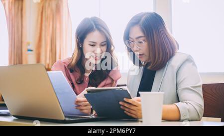 Businesswoman consult analyzing company financial cash flow result. Concept for teamwork business corporate and economy fund. Stock Photo