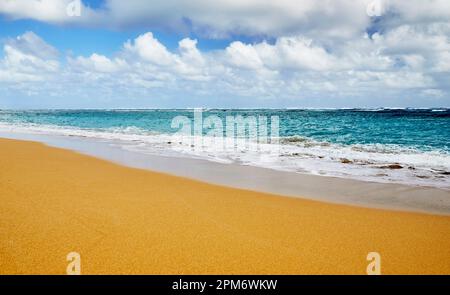 Ocean waves breaking onto a sand beach Stock Photo