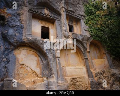 Sarcophagus or rock tombs in ruins of the ancient city of Termessos without tourists near Antalya, Turkey Stock Photo