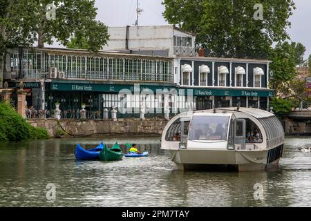 El Rana verde restaurant and boat trip excrusion on rio Tajo river or Tagus river in the La Isla garden Aranjuez Spain.  The Tagus begins its journey Stock Photo