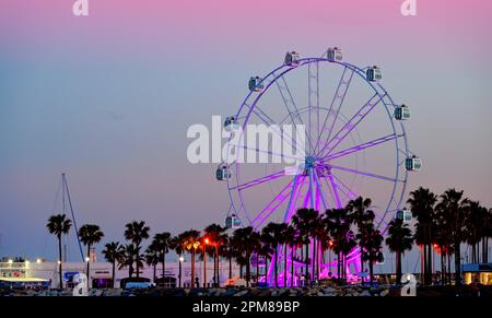 Malaga Benalmadena Marina Ferris Wheel at early evening after  sunset Stock Photo