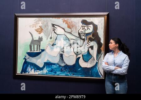 London, UK. 12 April 2023. PABLO PICASSO, Femme nue couchée jouant avec un chat, 1964, Estimate USD 20-30 million.  Highlights from Sotheby's Blockbuster May Sales ahead of next month's New York auctions. Credit: amer ghazzal/Alamy Live News Stock Photo