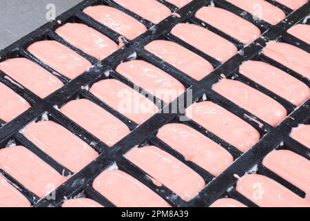 France, Marne, Reims, Maison Fossier (Living Heritage company), biscuit factory, manufacture of pink biscuits from Reims (champenoise specialties) created at the end of the 17th century, stage before baking Stock Photo
