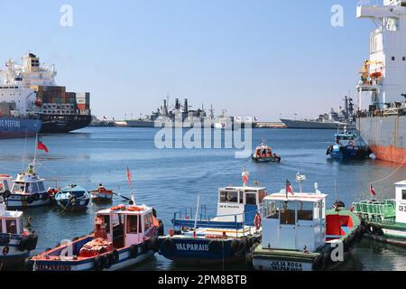 Chilean Navy Anti submarine frigates side by side docked in the port of Valparaiso, cargos & fishing boats, Armada de Chile, warship, containers Stock Photo