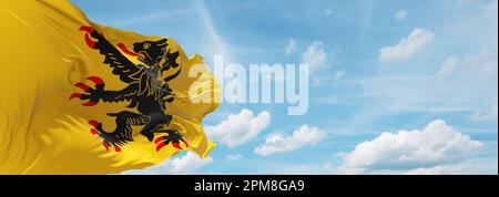 flag of Dutch peoples French Flemish people at cloudy sky background, panoramic view. flag representing extinct country,ethnic group or culture, regio Stock Photo