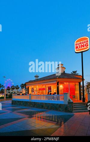 Malaga Benalmadena Mirador Ferris Wheel at twilight and the  Burger King eatery Stock Photo