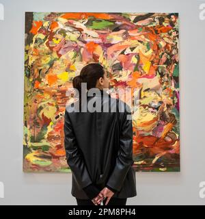 London, UK.  12 April 2023. A staff member views “Free Games for May”, 2015, by Cecily Brown (Est. US$3 - 5 million) at a photocall for a highlights exhibition of masterworks, with over $250m worth of artwork on display at Sotheby’s New Bond Street galleries, ahead of their being auctioned in Sotheby’s New York sales in May. Credit: Stephen Chung / Alamy Live News Stock Photo