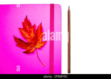 Pink Notepad With Pencil Isolated on White Background. Stock Photo