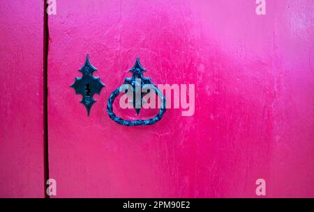 Vintage Padlock with Handle on a Pink Textured Background. Stock Photo