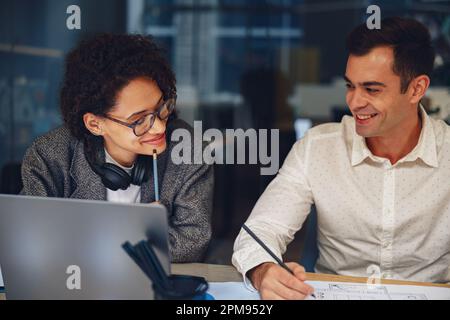 Two colleagues coworkers working together on new business plan during working day in office Stock Photo