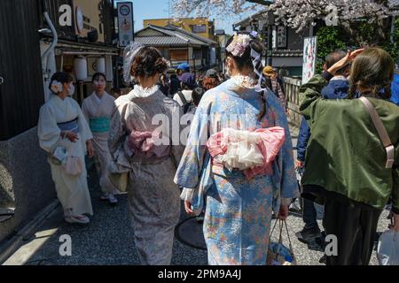 Kyoto, Japan - March 28, 2023: Women dressed in kimonos walk on Sannenzaka, a cobbled pedestrian street in Kyoto, Japan. Stock Photo