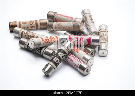 Pile of small electrical fuses for plugs isolated on a white background. Stock Photo