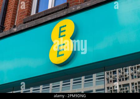 London. UK- 04.09.2023. The name sign of a retail branch of EE on Oxford Street. A British national mobile network and internet service provider. Stock Photo