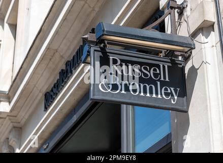 London. UK- 04.09.2023. A store sign of the luxury shoes and handbags retailer Russell and Bromley in Regent Street. Stock Photo