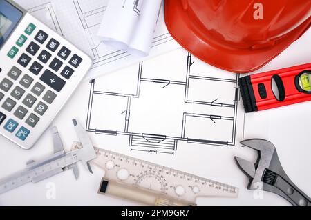 blueprint, calculator and tools on the desktop Stock Photo