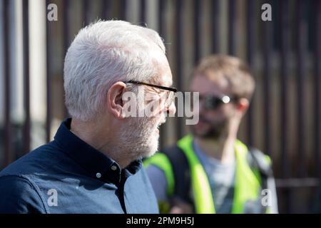 Jeremy Corbyn is seen as supporters of WikiLeaks founder Julian Assange gather to form a human chain around the Houses of Parliament in London. Stock Photo