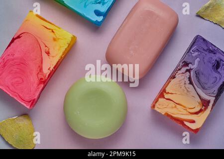 Selection of colourful soaps on a pink background. Stock Photo