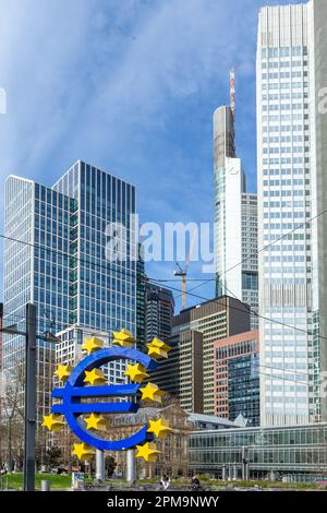 Frankfurt, Germany - March 28, 2023: the Euro sign in Frankfurt in front of skyscraper and the former european central bank building. Stock Photo
