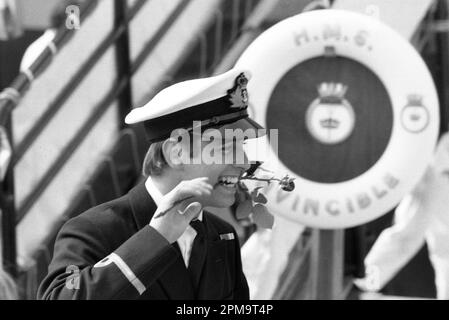 Prince Andrew, the Duke of York, was thrown a rose by the crowd on his arrival in Portsmouth, England, aboard HMS Invincible after serving in the Falklands war as a helicopter pilot. Credit: Rob Taggart/Alamy Stock Photo