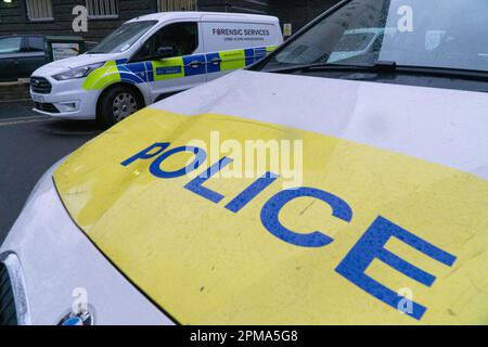 London, UK, 11 April 2023: Metropolitan police cars, including a van serving the forensics unit, parked outside Brixton Police station in South London.  Anna Watson/Alamy Live News Stock Photo