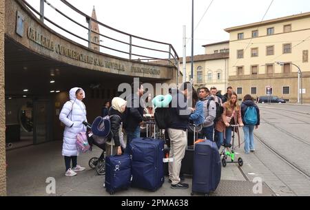 Florence, Italy. 12th Apr, 2023. Tourists seen outside Santa Maria Novella train station in Florence, Italy, on April 12 2023. As during Easter holidays Italy recorded an exceptional number of tourists from all around the world, Italian authorities spoke about 'overtourism' as a phenomenon that could jeopardy art cities and naturalistic spots in the Country. (Photo by Elisa Gestri/Sipa USA) Credit: Sipa USA/Alamy Live News Stock Photo