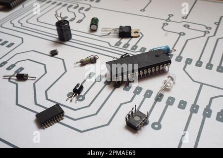 Electronic components on a printed circuit board pattern. Focused on integrated circuit  (IC). Stock Photo
