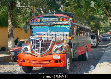 Chicken bus running in Antigua Guatemala Stock Photo