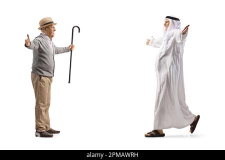 Senior man meeting an arab man in traditional muslim clothes isolated on white background Stock Photo