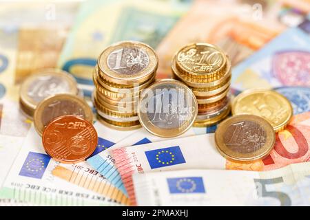 Euro coins banknotes bill saving money pay paying finances bank notes banknote rich Stock Photo