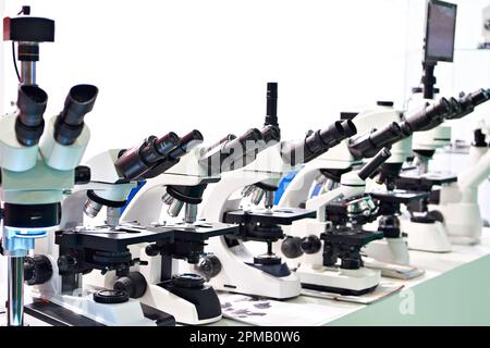 Optical microscopes in the store at the exhibition Stock Photo