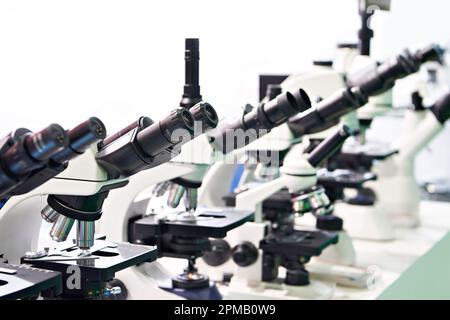 Optical microscopes in the store at the exhibition Stock Photo