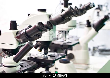 Optical microscopes in the store at the exhibition Stock Photo