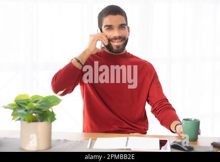 Portrait of attractive young man manager working at office Stock Photo