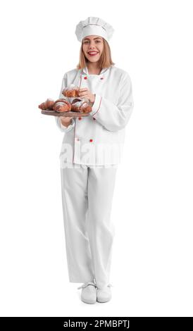 Female baker with board of tasty croissants on white background Stock Photo
