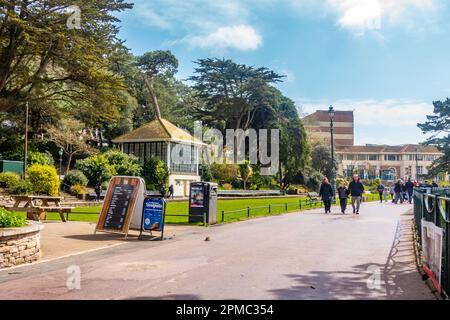 People walking through Lower Gardens, a public park and green space in Bournemouth, Dorset, UK Stock Photo